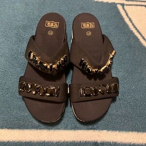 Brand is Ash, black satin like double strap sandals with jewels and rubber sole.